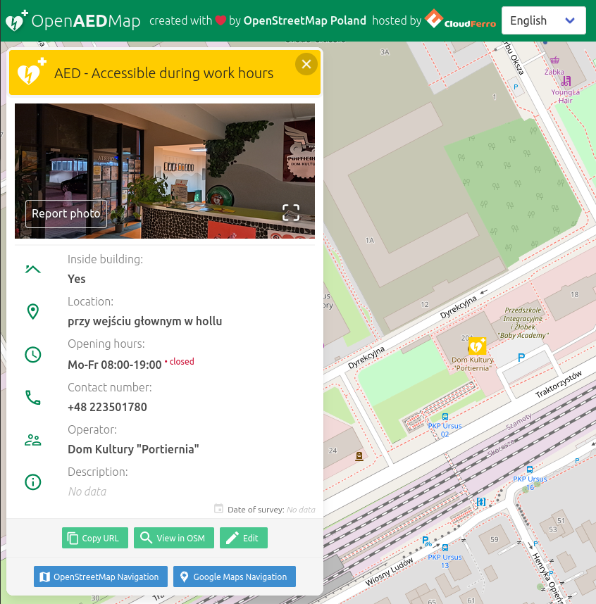 Screenshot of OpenAEDMap showing properties and a photo of a defibrillator